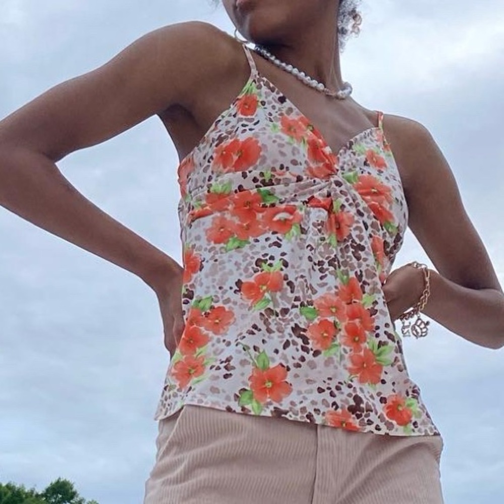 Women’s floral camisole top with adjustable straps.
